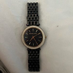 Black and gold Michael Kors watch